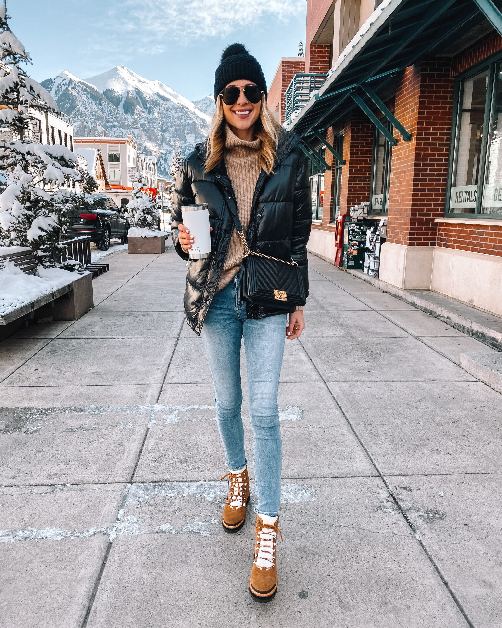 Puffer Jacket and Turtleneck for Snowy Adventures — Winter Travel Outfits