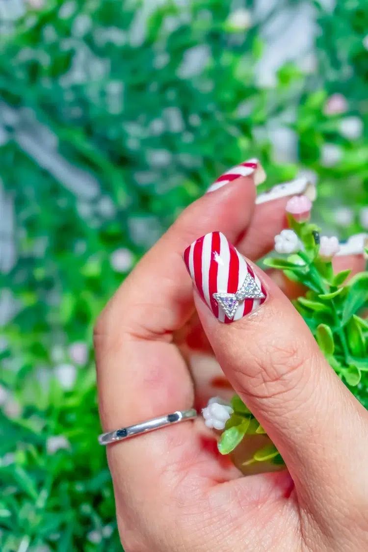 Red Stripe Silver Bow Nails — Christmas Nails for Women Over 50 2026