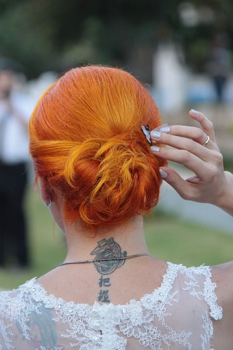 Vibrant Orange Textured Low Bun Vibrant Orange Textured Low Bun β Winter Updos
