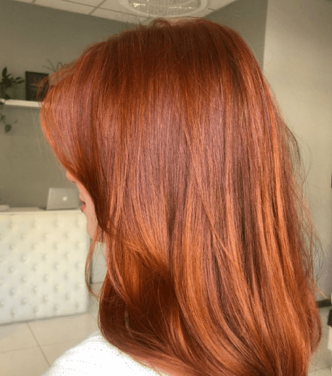 Mid-Back Vibrant Copper Red Waves Mid-Back Vibrant Copper Red Waves β Winter Hair Colors for Women Over 50