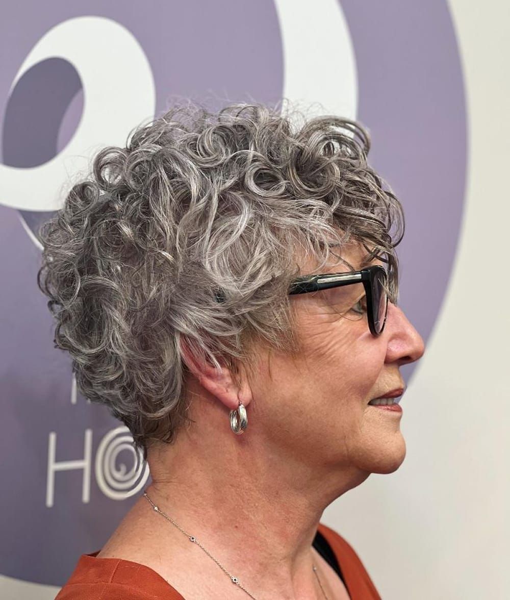 Salt and Pepper Ear Length Curly Cut — Winter Hair Colors for Women Over 70