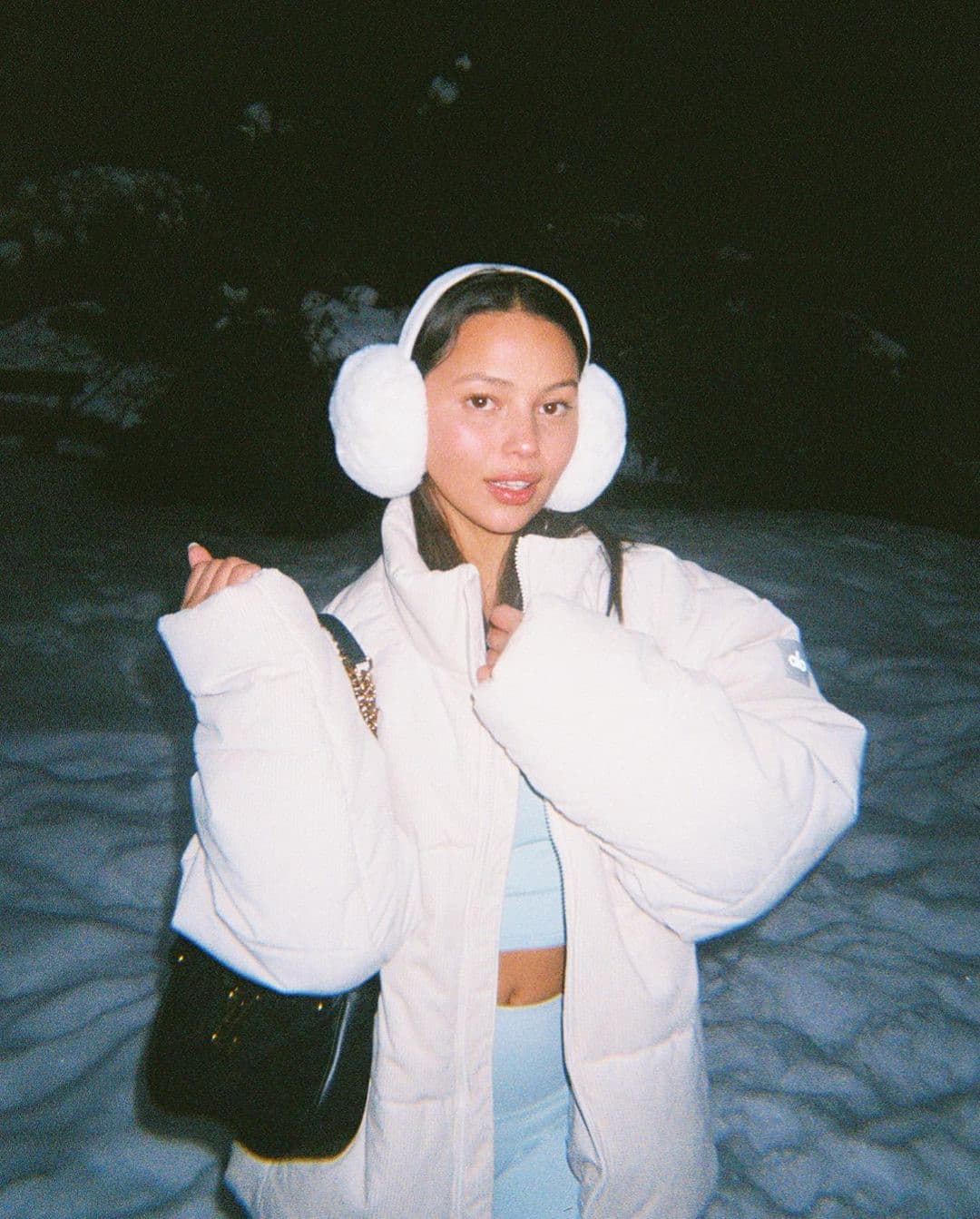Cream Puffer Jacket with Fluffy Earmuffs for Apres Ski Chic — Apres Ski Outfits