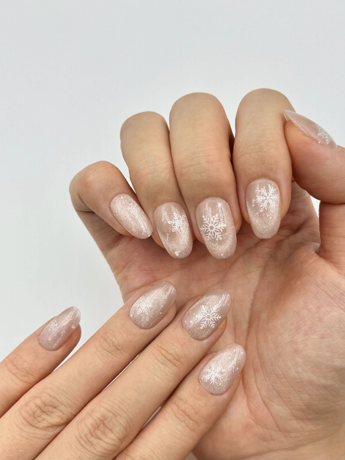 Shimmering Nude With Delicate White Snowflakes Shimmering Nude With Delicate White Snowflakes β Snowflake Nails