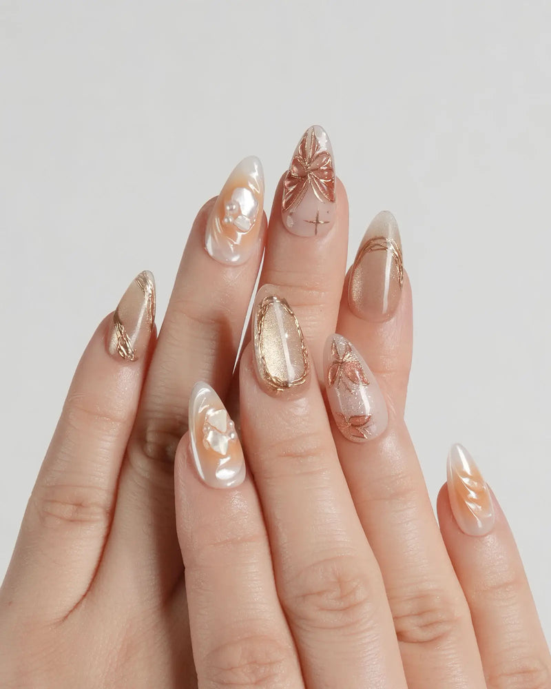 Nude Rose Gold Pearl Embellished Almond Nails Nude Rose Gold Pearl Embellished Almond Nails β Medium Length Winter Nails
