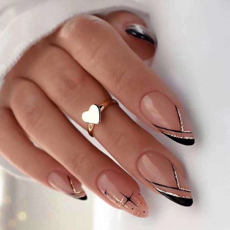 Abstract Black and Gold Almond Nails Abstract Black and Gold Almond Nails โ Winter Almond Nails