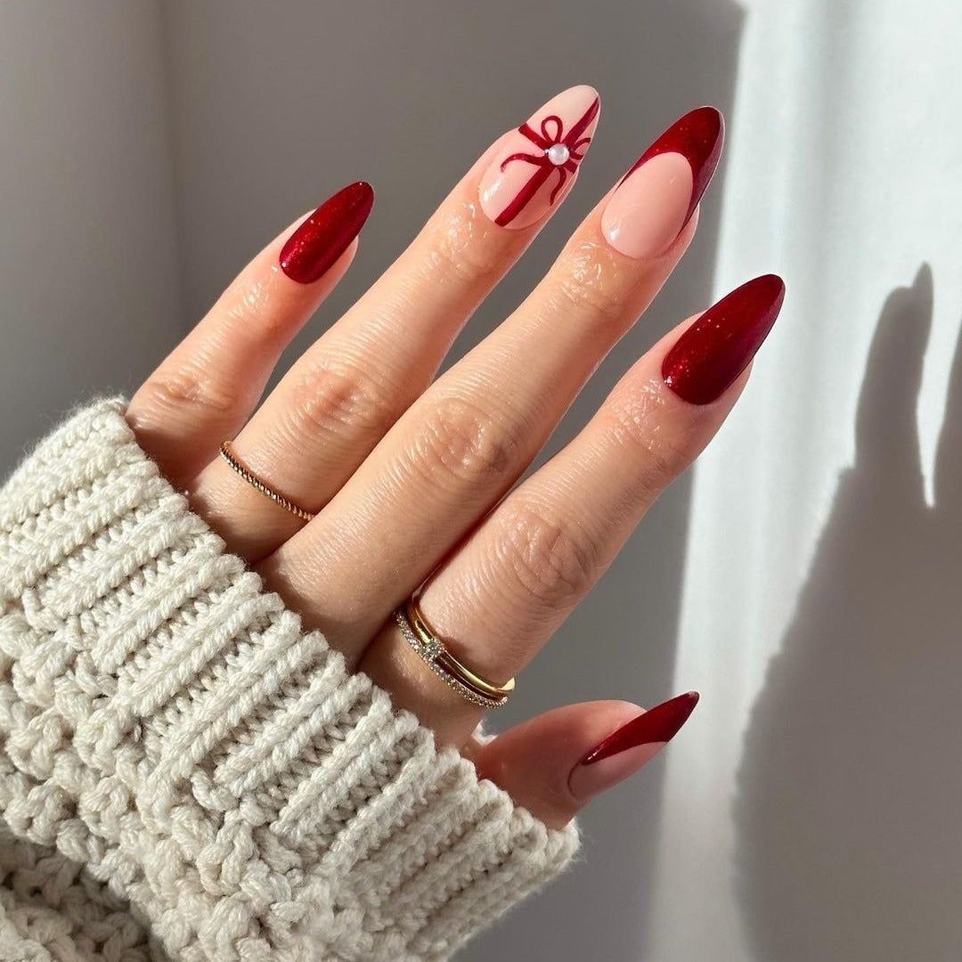 Deep Red Metallic Stilettos with Bow Accent Deep Red Metallic Stilettos with Bow Accent β Red Christmas Nails 2026