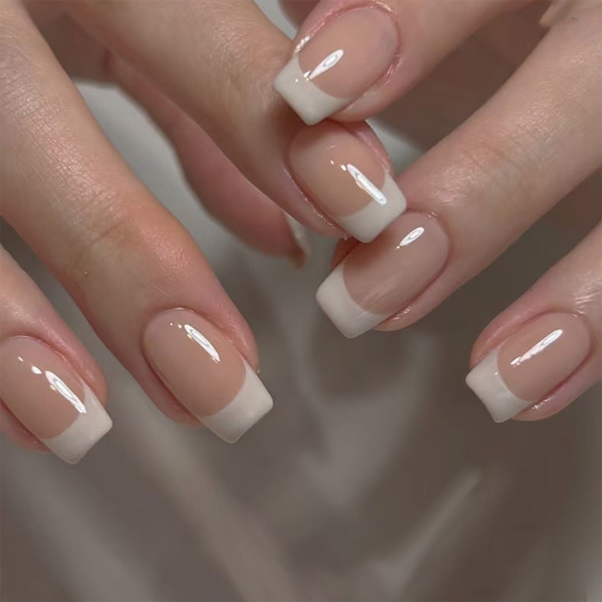 Sharp White French Tips on Short Nude Nails Sharp White French Tips on Short Nude Nails β Winter French Tip Nails