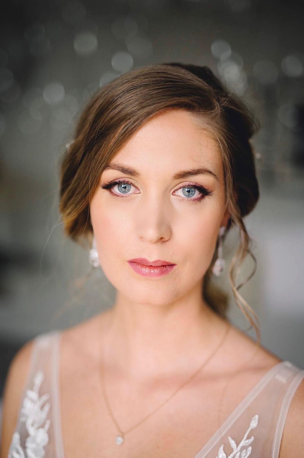 Elegant Updo With Wispy Bangs — Winter Hair Colors for Blue Eyes
