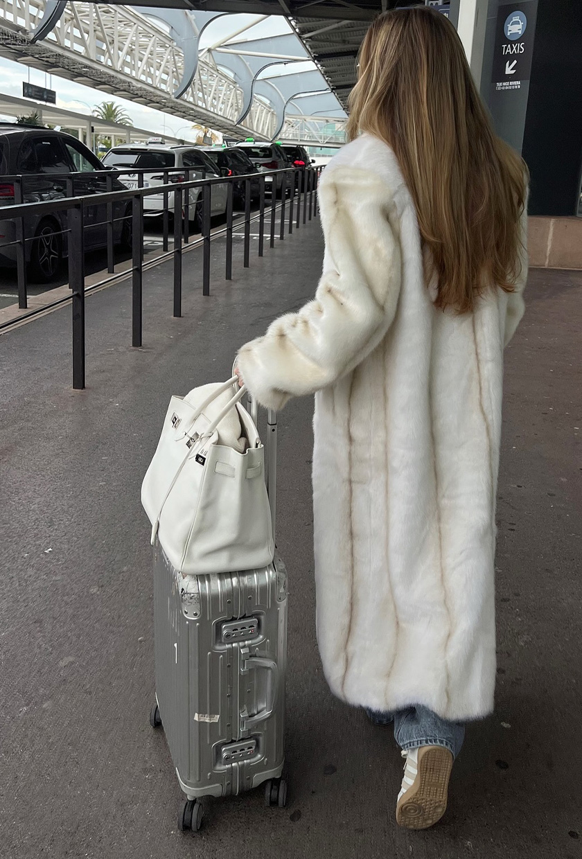 Glamorous Statement: Faux Fur Coat with Denim Glamorous Statement: Faux Fur Coat with Denim β Winter Airport Outfits