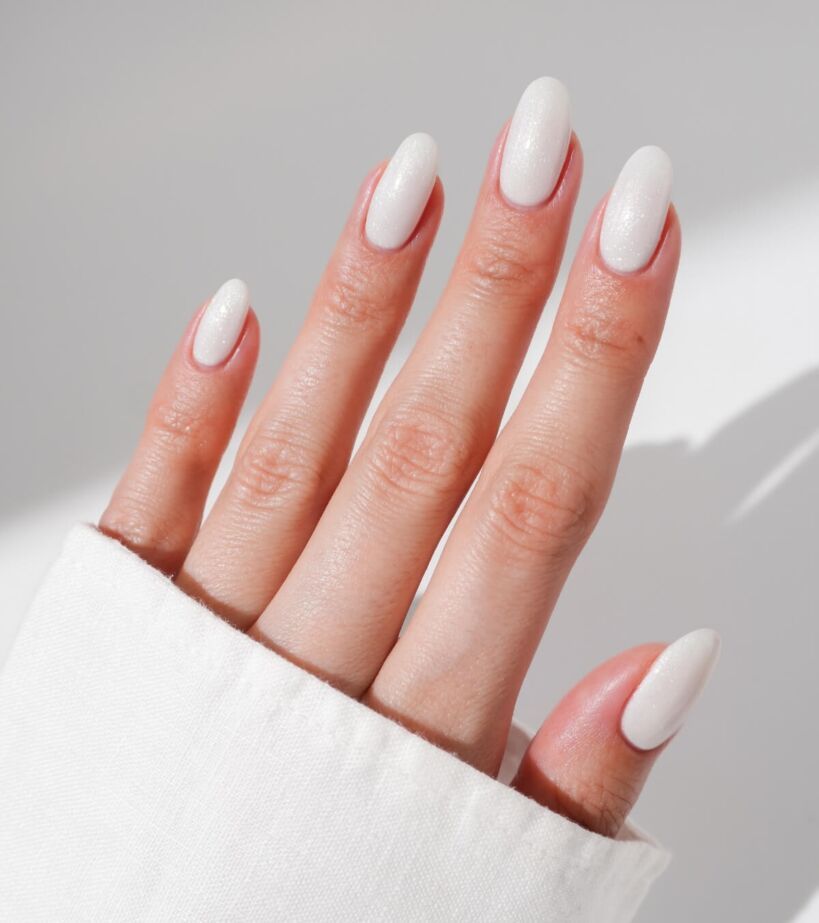 Glossy White Shimmer Medium Almond Nails — Winter Nail Colors for Pale Skin
