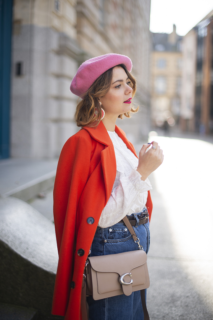 Bright Orange Coat Over White Blouse and Blue Jeans Bright Orange Coat Over White Blouse and Blue Jeans β Colorful Winter Outfits