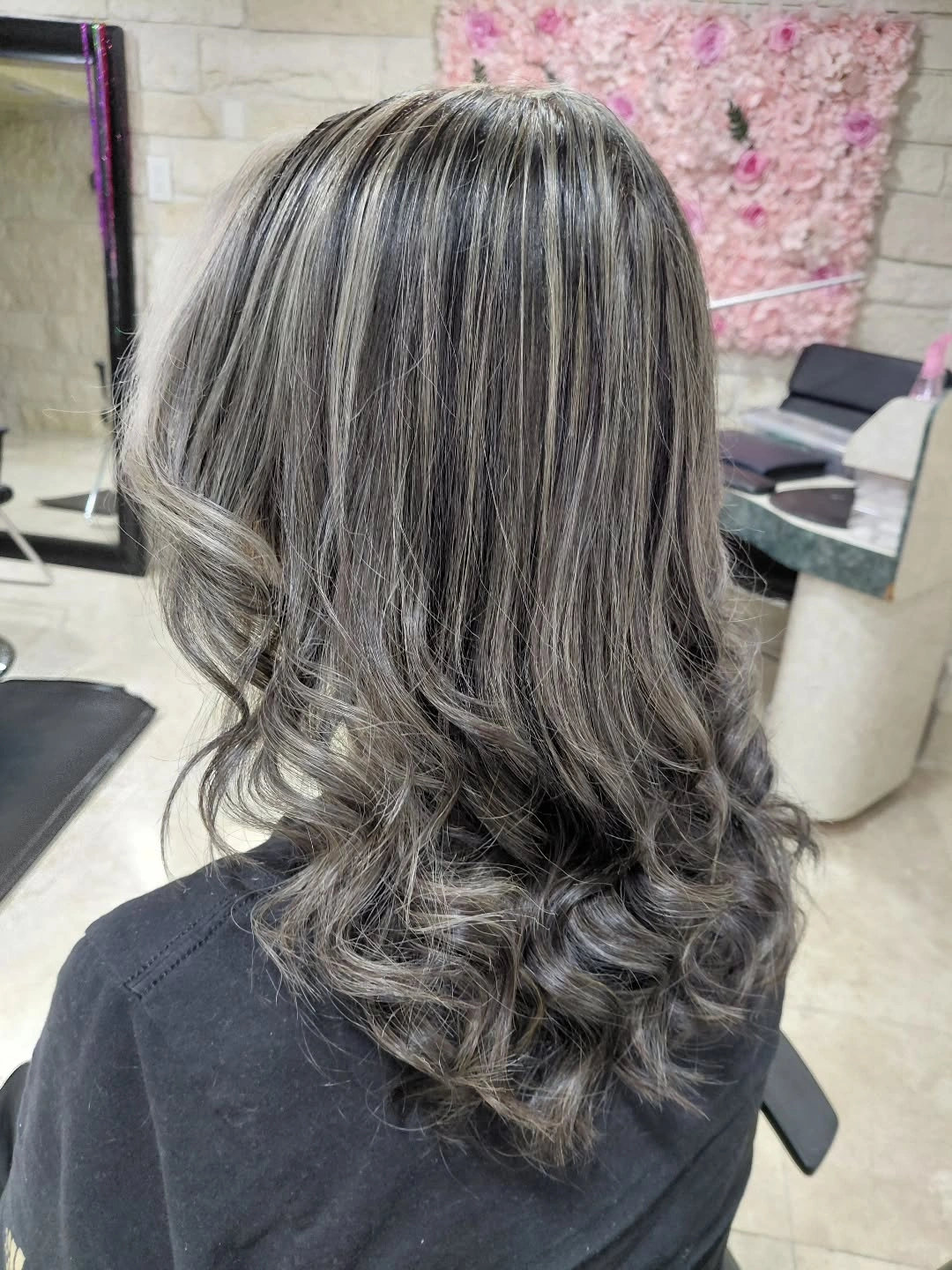 Medium-length silver gray hair with charcoal depth and curled ends Medium-length silver gray hair with charcoal depth and curled ends