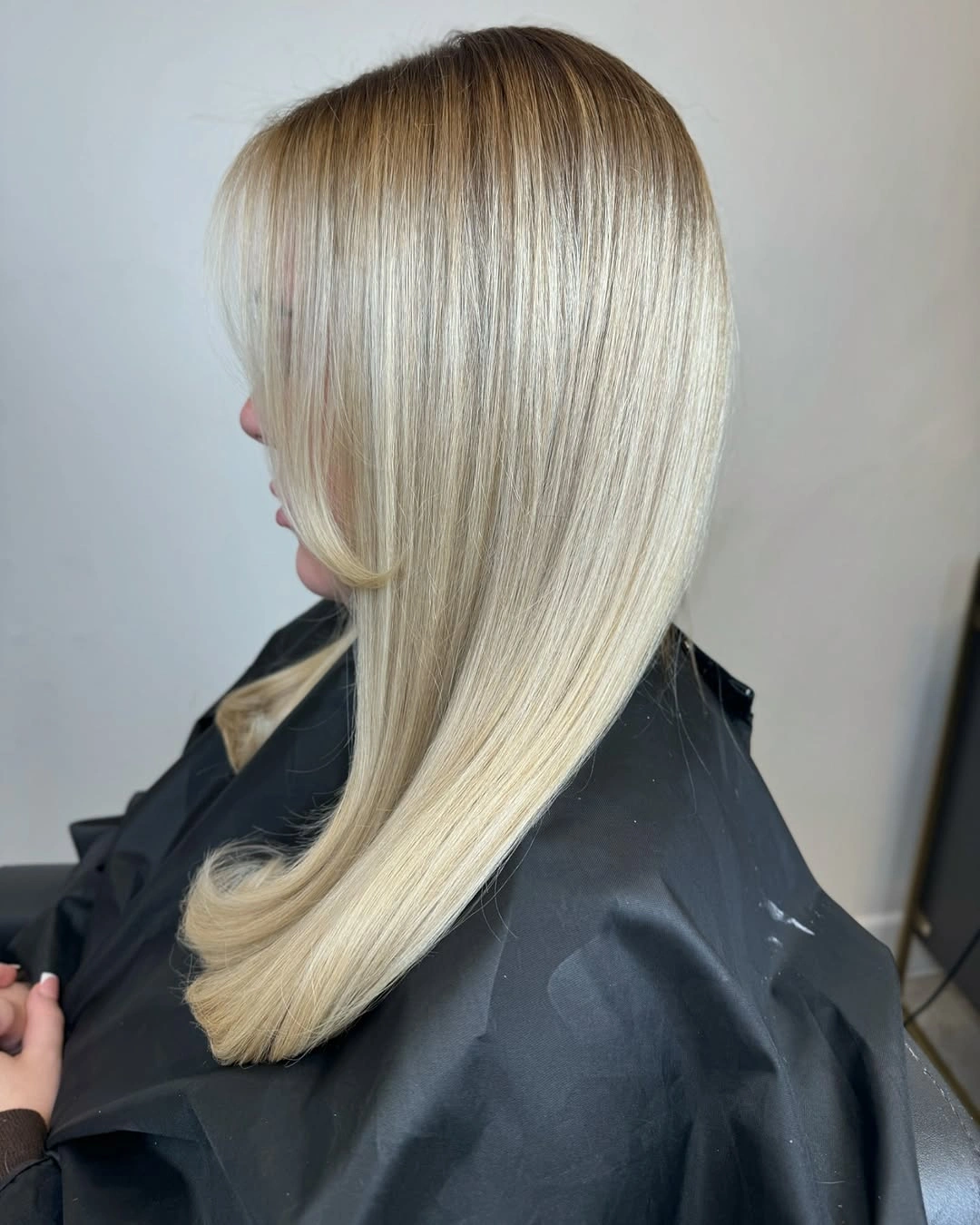 Long sleek platinum blonde hair with pale creamy tones and curved ends Long sleek platinum blonde hair with pale creamy tones and curved ends