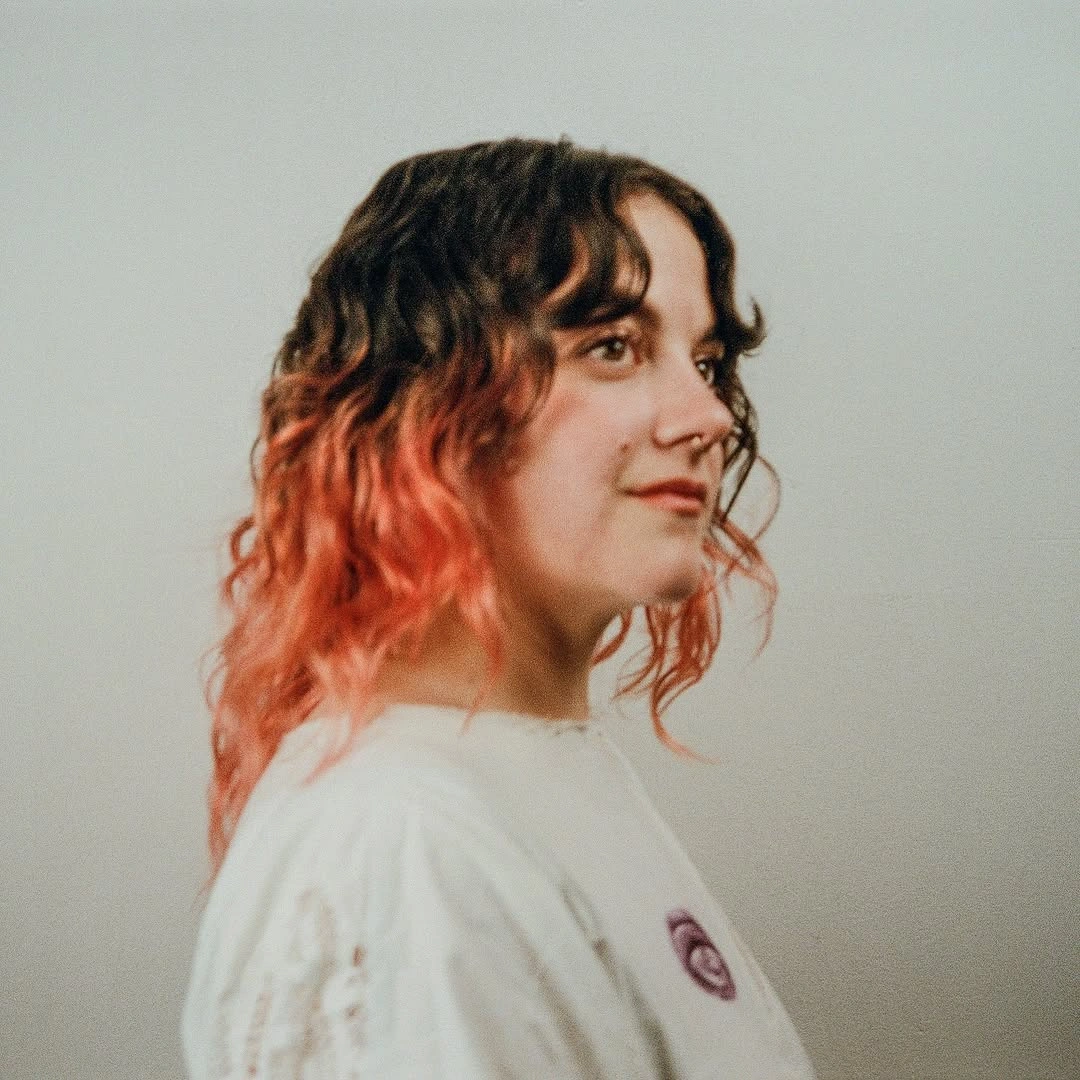 Short dark curly hair with peach orange and copper red ends Short dark curly hair with peach orange and copper red ends