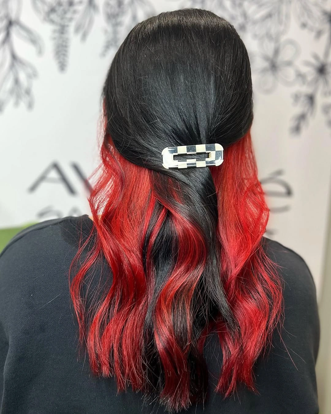 Black half-up hairstyle with vivid scarlet red underlayers and wavy ends Black half-up hairstyle with vivid scarlet red underlayers and wavy ends