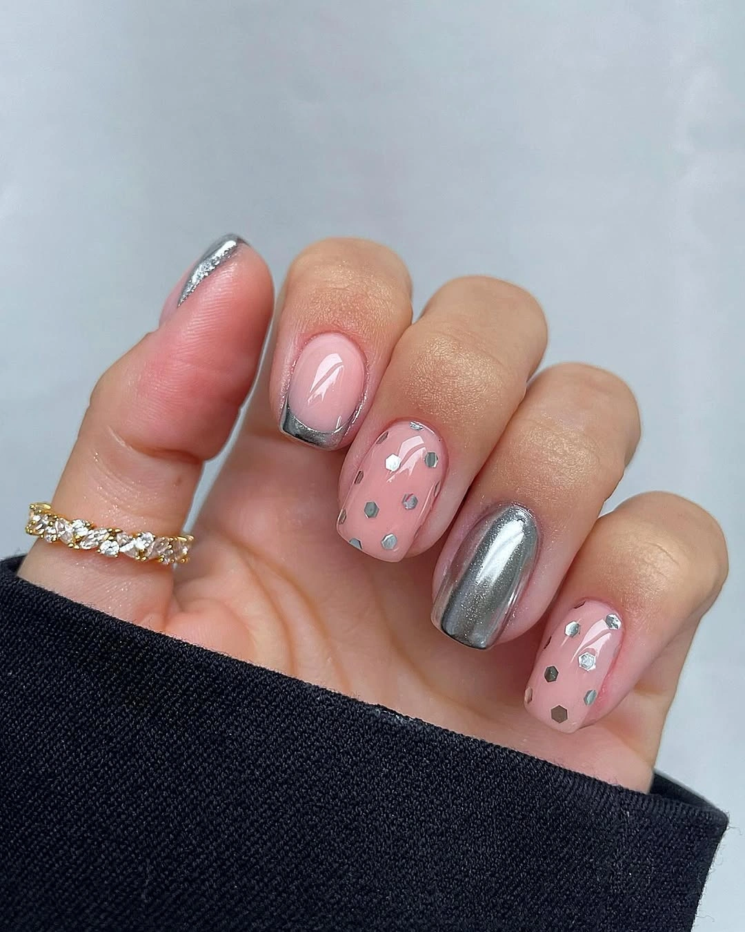 Short pink square nails with silver chrome and scattered metallic dots Short pink square nails with silver chrome and scattered metallic dots