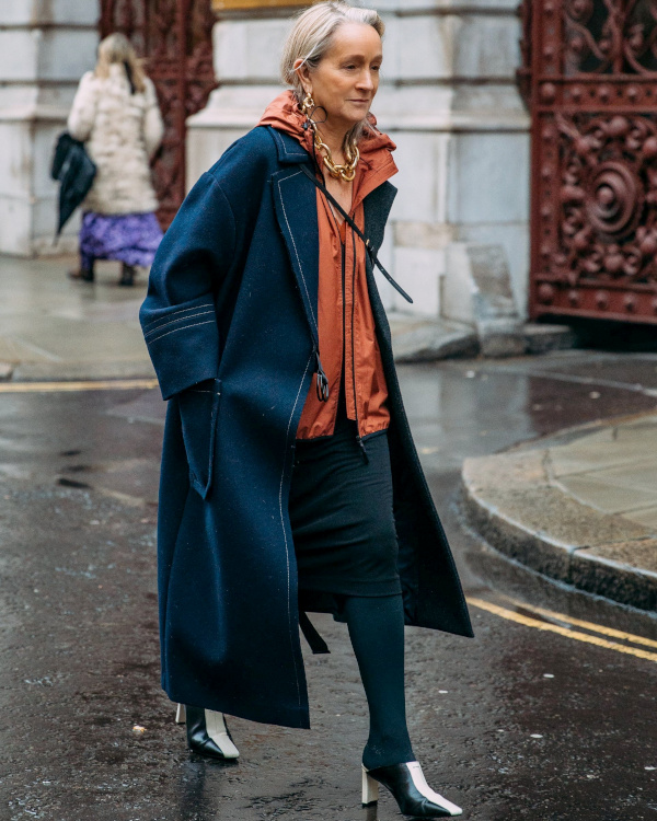 Layered Navy Coat with Orange Hoodie and Heeled Boots Layered Navy Coat with Orange Hoodie and Heeled Boots β Winter Outfits for Women Over 60