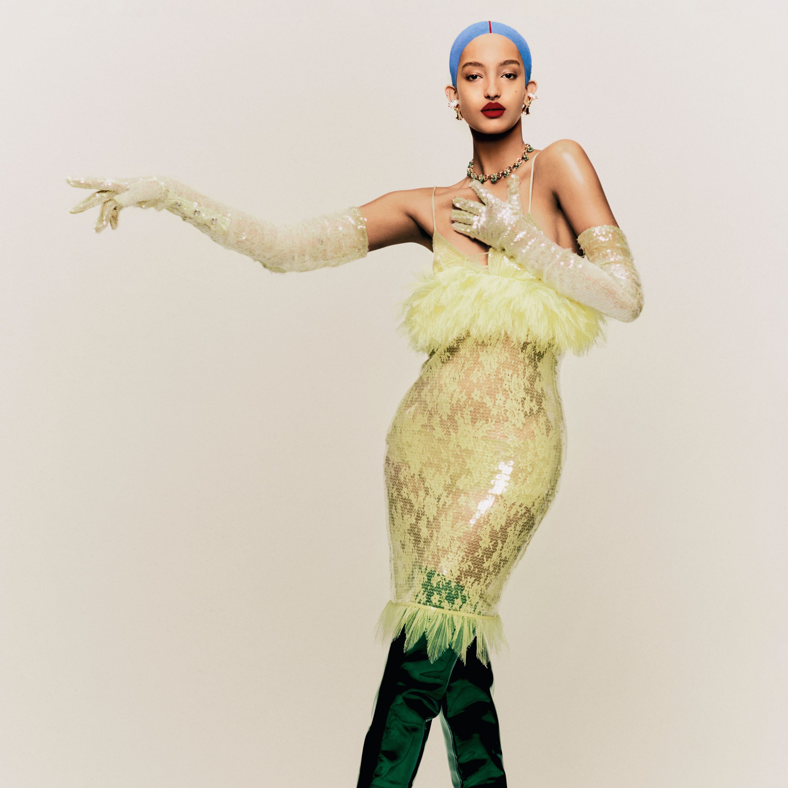 Pale Yellow Sequin Dress with Feather Trim and Emerald Satin Pants — Winter Party Outfits