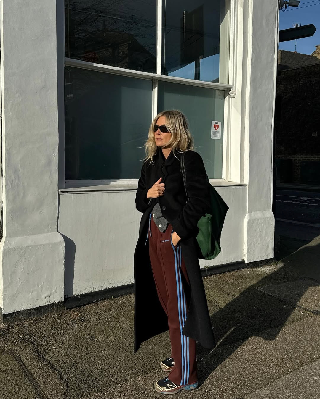 Athleisure Blend: Wool Coat with Track Pants Athleisure Blend: Wool Coat with Track Pants β Winter Airport Outfits