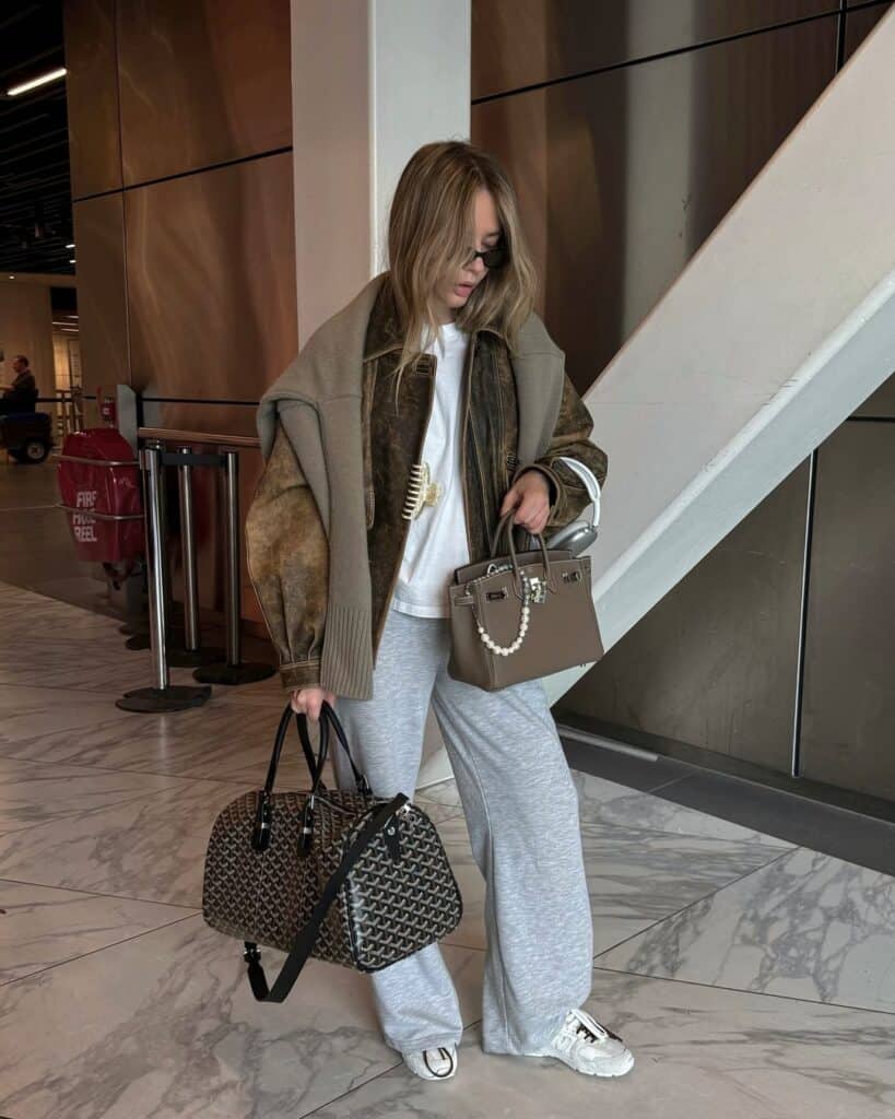 Chic Layers: Shearling Jacket with Draped Sweater Chic Layers: Shearling Jacket with Draped Sweater β Winter Airport Outfits