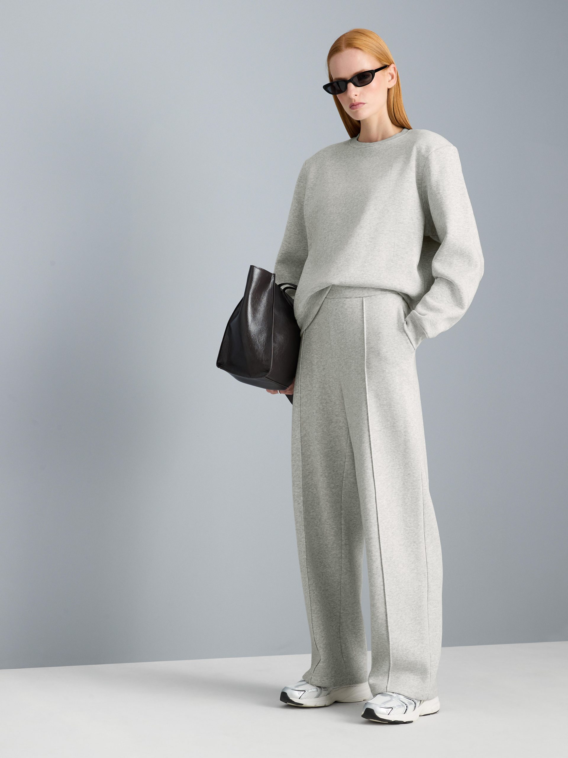 Casual Cohesion: Grey Fleece Set with Wide-Leg Trousers Casual Cohesion: Grey Fleece Set with Wide-Leg Trousers β Winter Airport Outfits