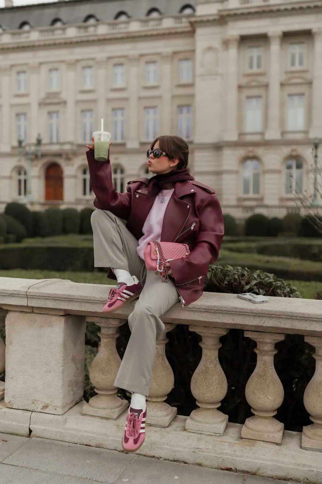 Burgundy Leather Jacket with Pink Sweater and Grey Trousers Burgundy Leather Jacket with Pink Sweater and Grey Trousers β Minimalist Winter Outfits