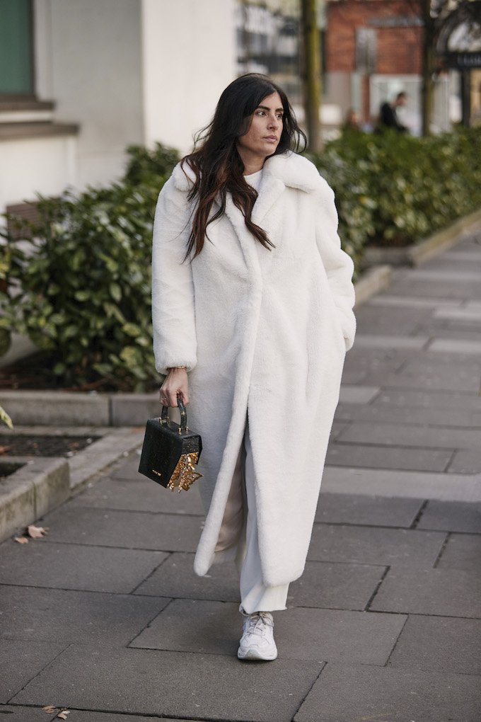Oversized Faux Fur Coat Over White Tee and Beige Trousers — Winter White Outfits