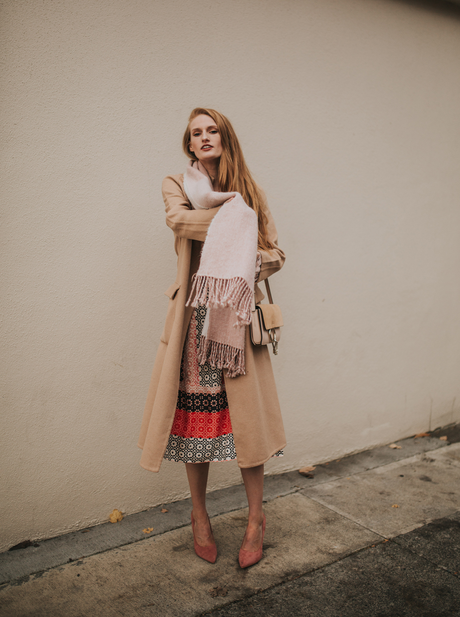 Camel Coat Layered Over a Vibrant Patterned Midi Dress Camel Coat Layered Over a Vibrant Patterned Midi Dress β Camel Coat Outfits