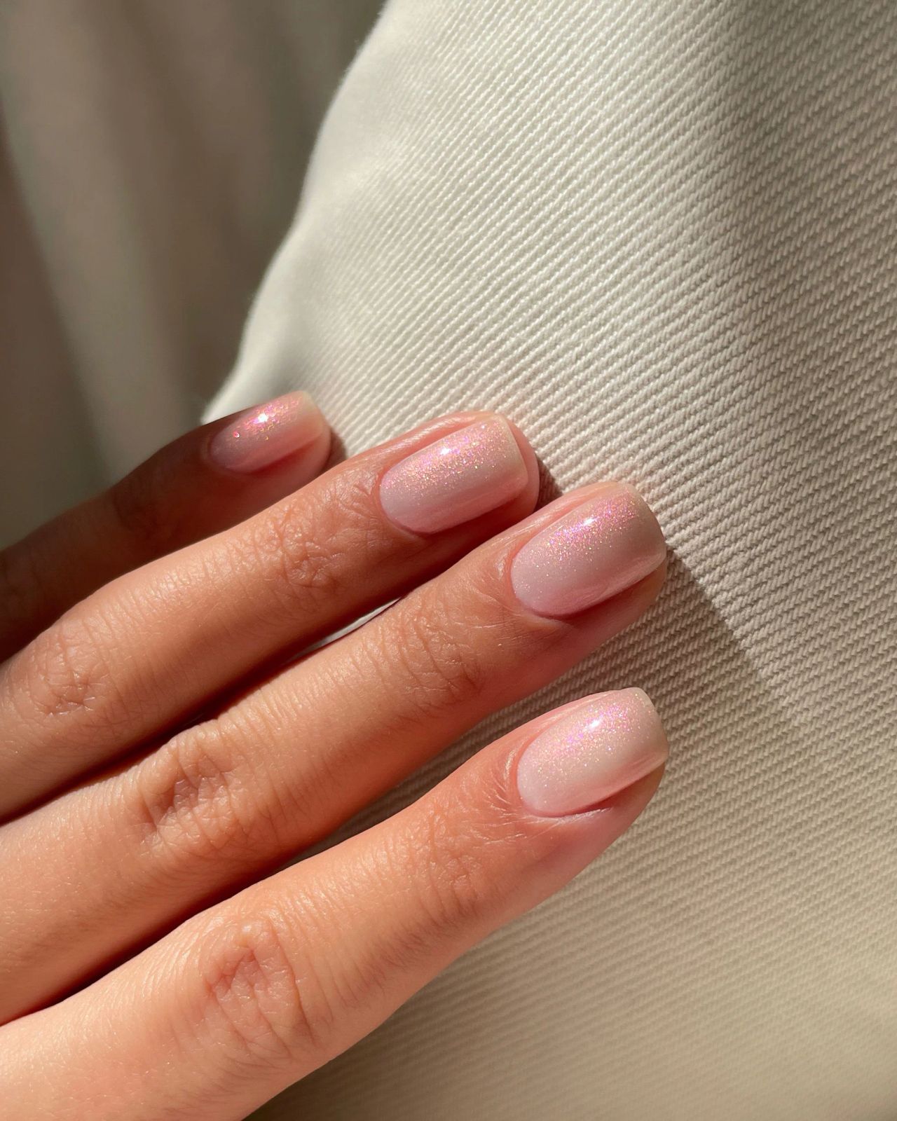 Elegant Pale Pink Iridescent Shimmer Nails Elegant Pale Pink Iridescent Shimmer Nails โ Winter Nail Colors for Women Over 40