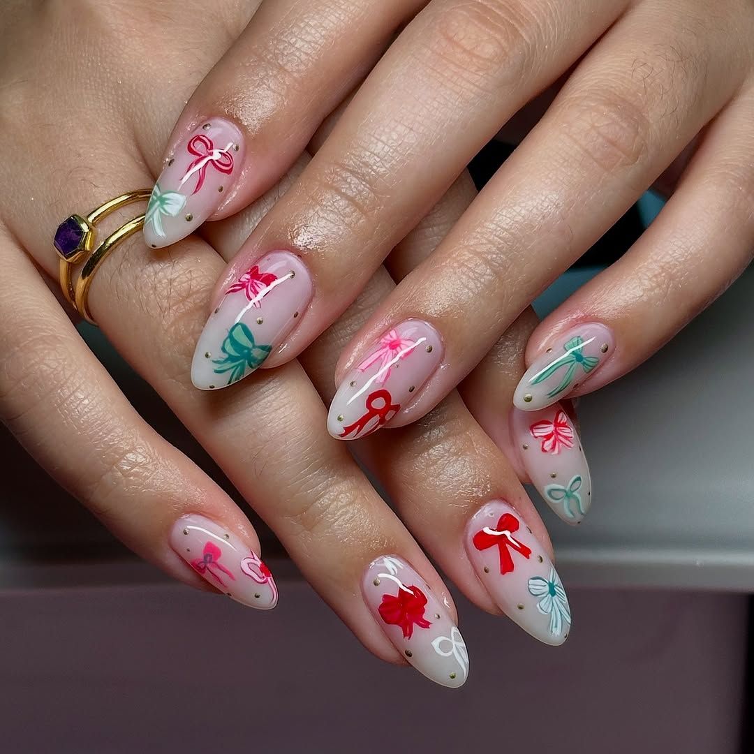 Sheer Pink Almond Nails with Cute Bows Sheer Pink Almond Nails with Cute Bows β Christmas Acrylic Nails 2026