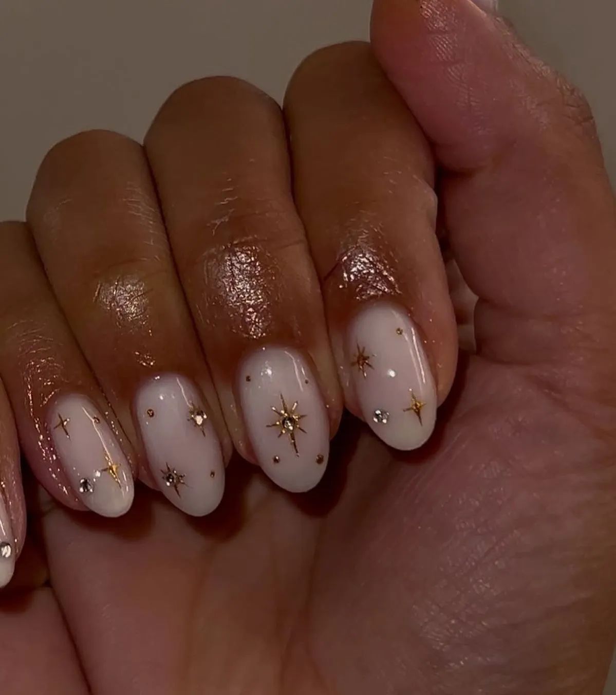 The Intricate Gold Star Embellishments Visual Idea — Christmas Nails for Dark Skin 2026