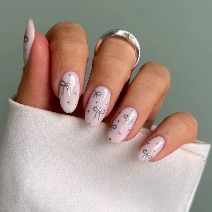 Pale Pink Glossy with Silver Bow Decals — Holiday Nail Colors 2026