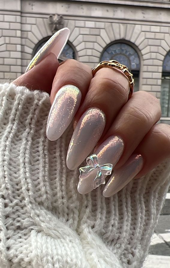 Milky Iridescent Bow Charm Oval Nails Milky Iridescent Bow Charm Oval Nails β Holiday Party Nails 2026