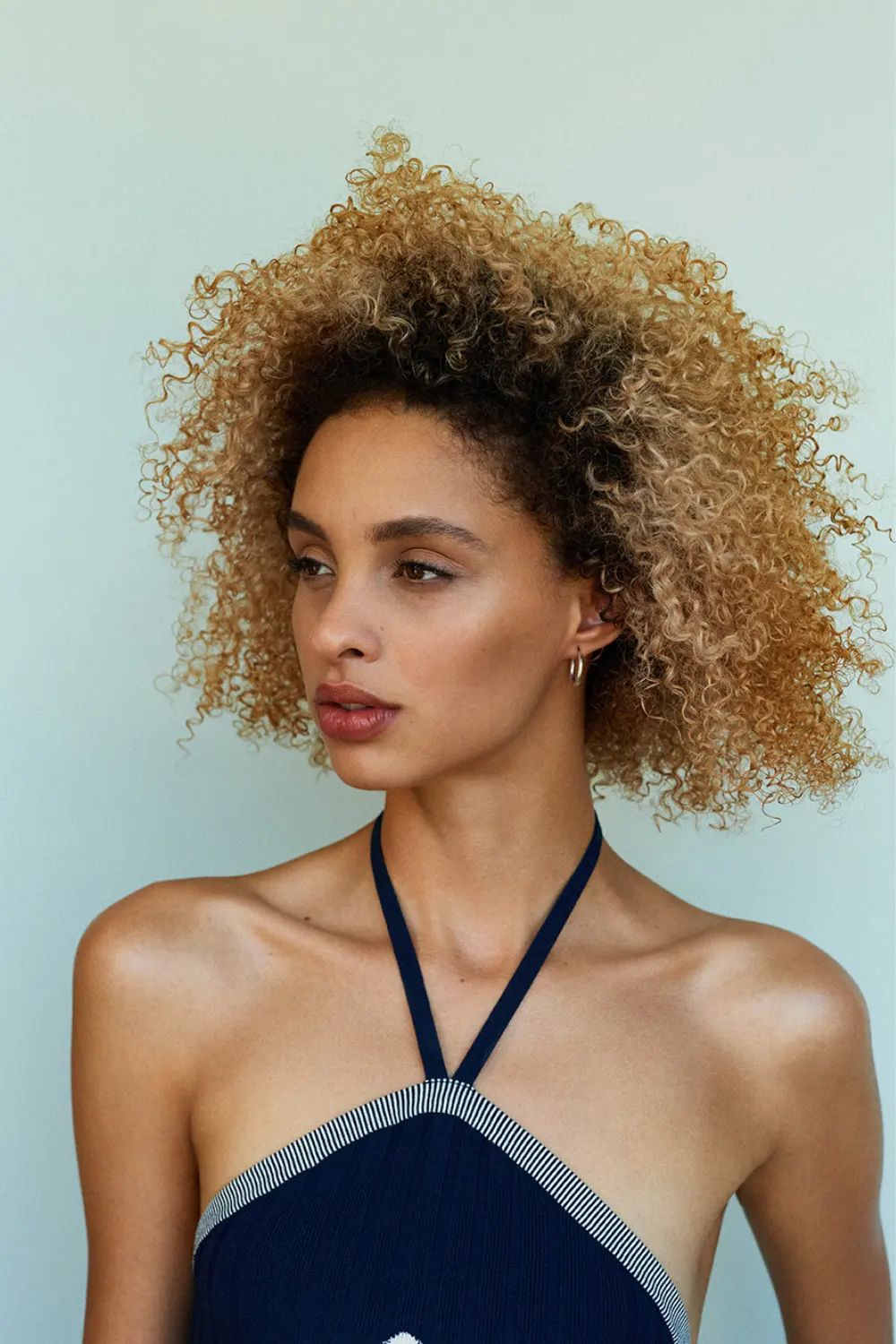 Voluminous Curly Ear-Length Layers Voluminous Curly Ear-Length Layers β Winter Haircuts for Heart Shaped Faces