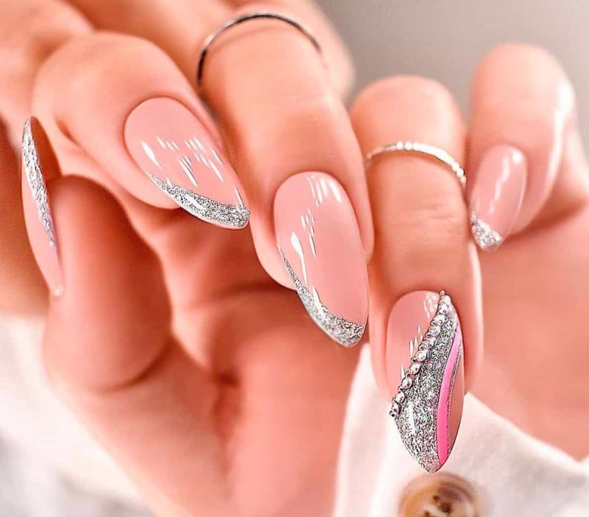 Light Pink Almonds with Glitter and Rhinestone Accents Light Pink Almonds with Glitter and Rhinestone Accents β Classy New Years Nails 2027