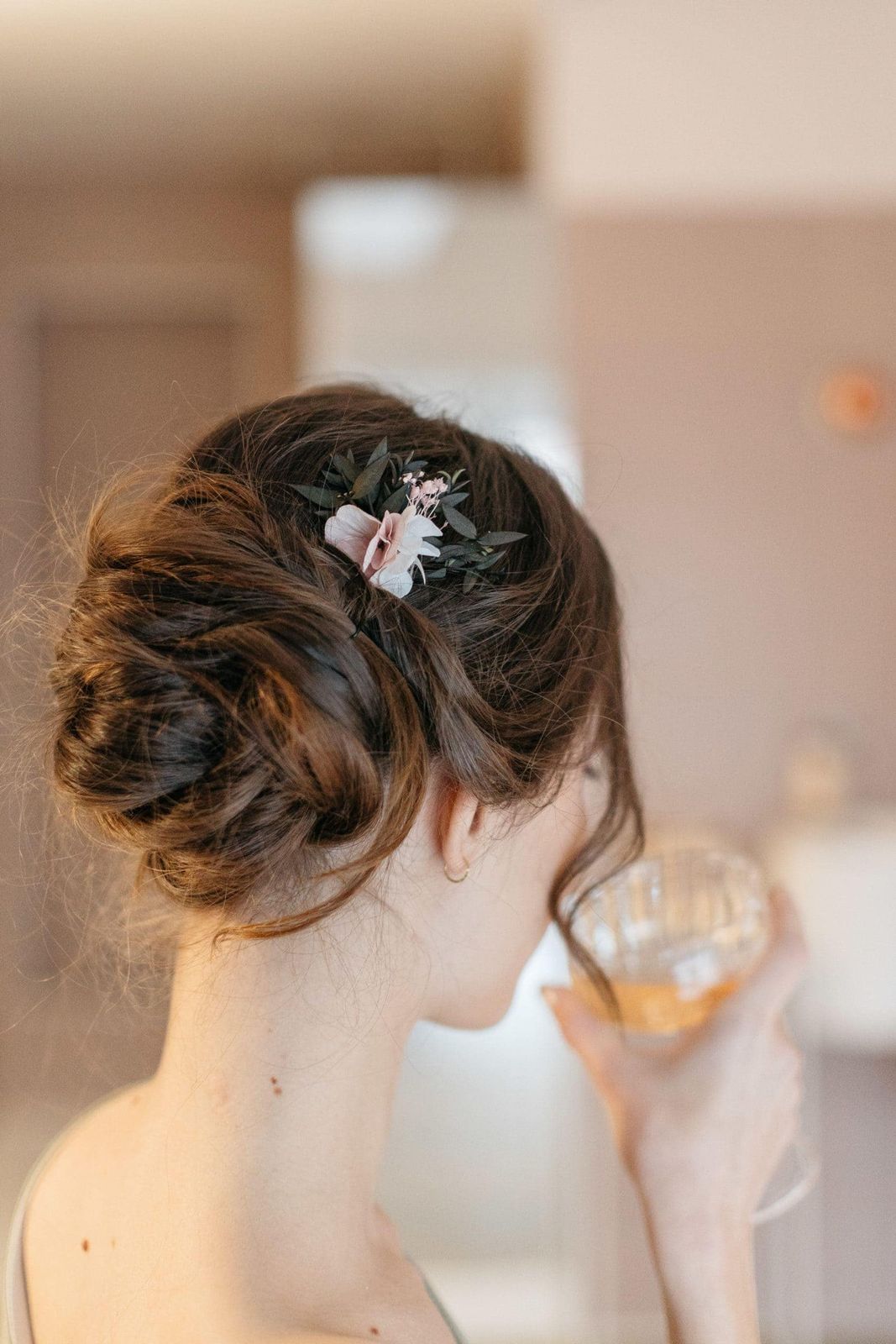 Updo With Floral Accessory — Winter Date Night Hairstyles