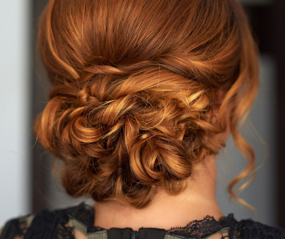 Low Twisted Bun With Copper Highlights — Winter Date Night Hairstyles