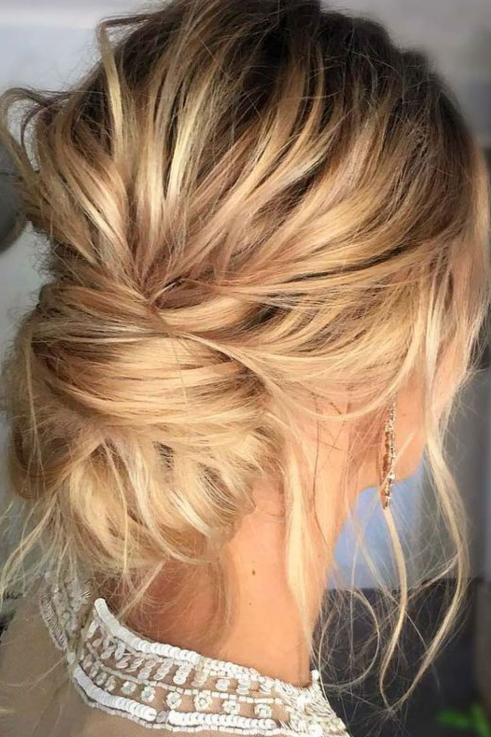 Ash Blonde Messy Bun With Face-Framing Pieces Ash Blonde Messy Bun With Face-Framing Pieces β Winter Bun Hairstyles