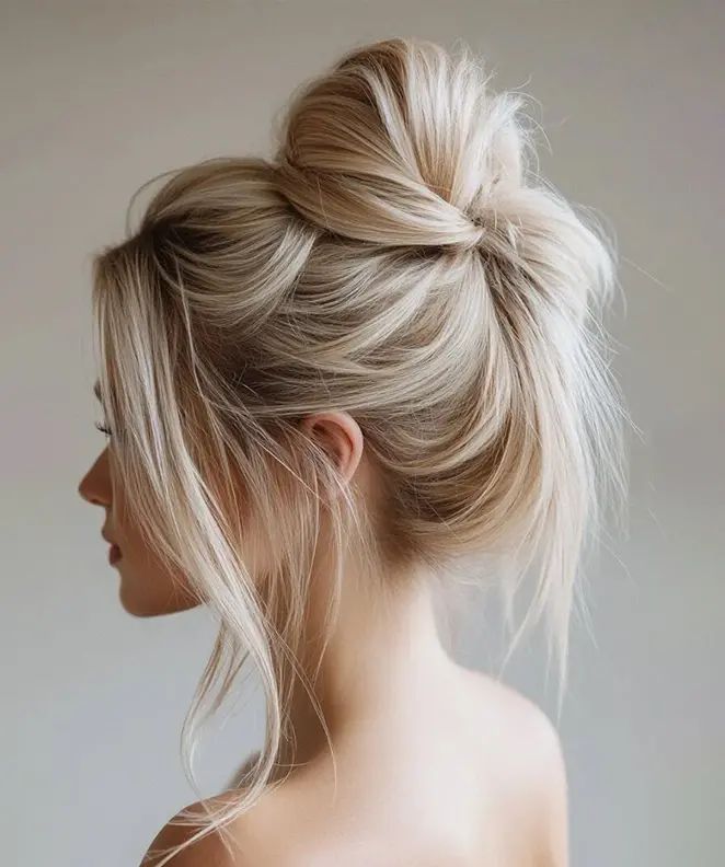 High Messy Bun With Curtain Bangs High Messy Bun With Curtain Bangs β Winter Bun Hairstyles