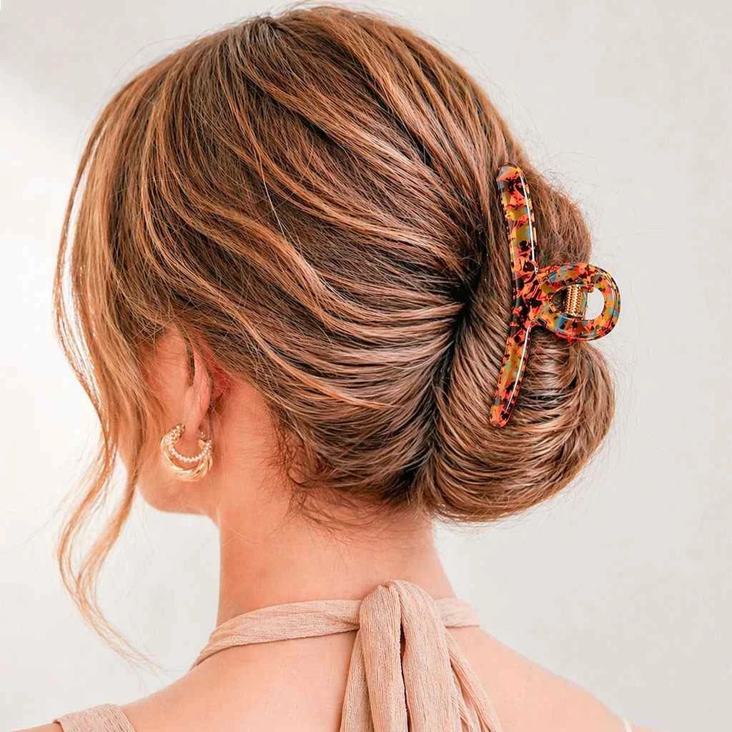 Low Bun With Tortoise Shell Claw Clip — Winter Hairstyles for Thick Hair