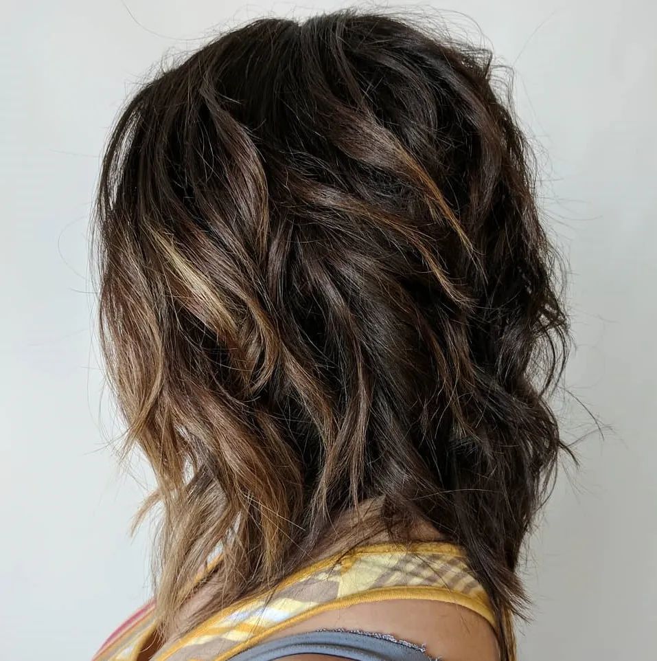 Mid-Length Wavy Shag With Choppy Layers — Winter Hairstyles for Thick Hair