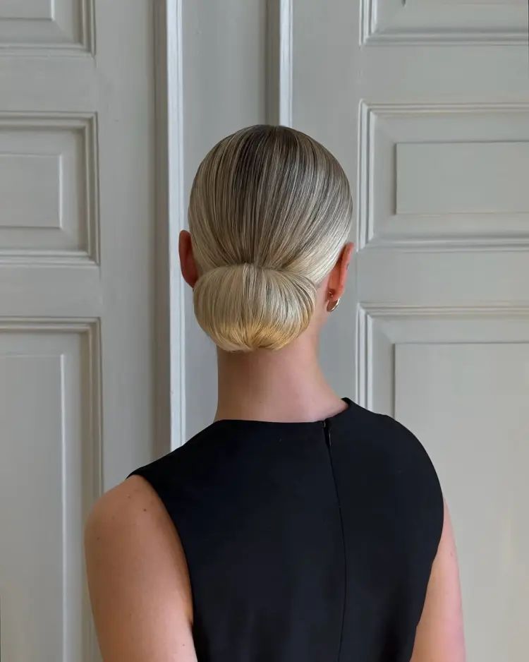 Smooth Rounded Low Bun Ash Blonde Smooth Rounded Low Bun Ash Blonde β Winter Party Hairstyles