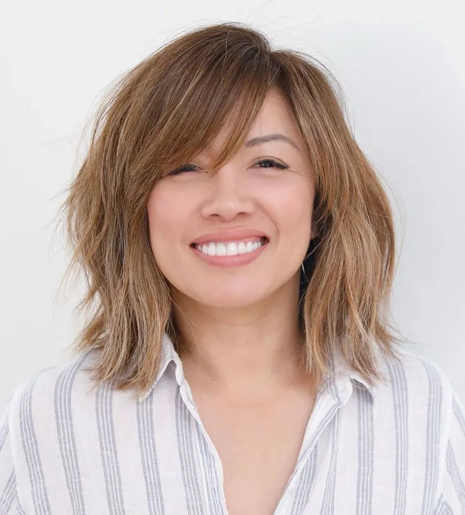 Choppy Layers With Side-Swept Bangs — Winter Hairstyles for Round Faces