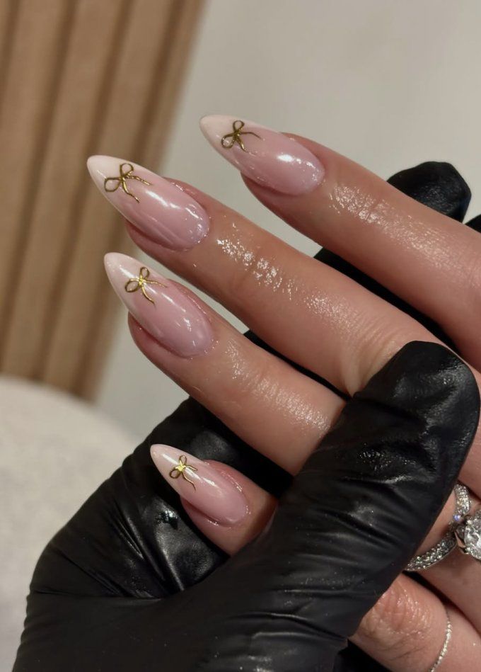 Gold Bow Charms On All Visible Nails Visual Idea — Christmas Almond Nails 2026