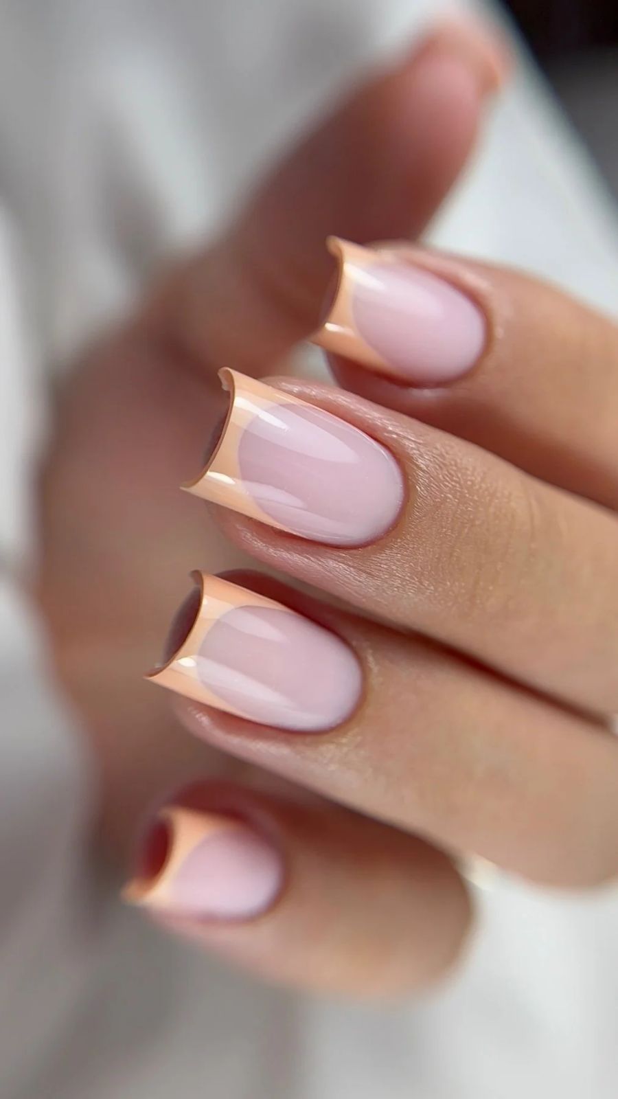 Abstract Peach French Tip Medium Oval Nails — New Years Gel Nails 2027